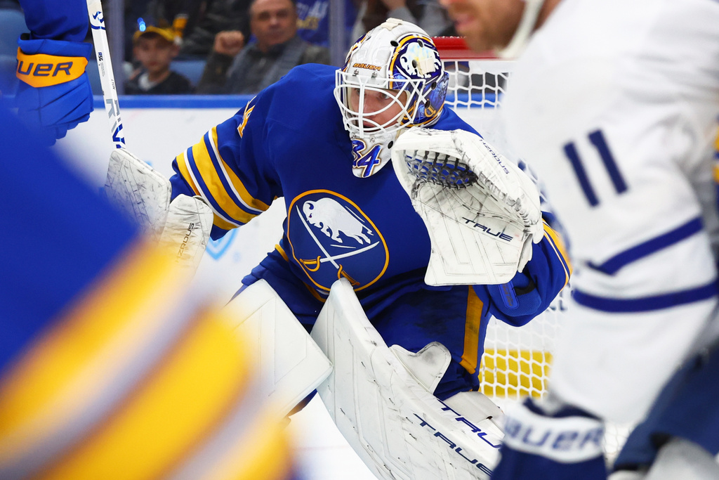 Buffalo Sabres goaltender Alex Lyon looks for the puck in traffic during the second period of an NHL hockey game against the Toronto Maple Leafs, Saturday, March 14, 2026, in Buffalo, N.Y. (AP Photo/Jeffrey T. Barnes)