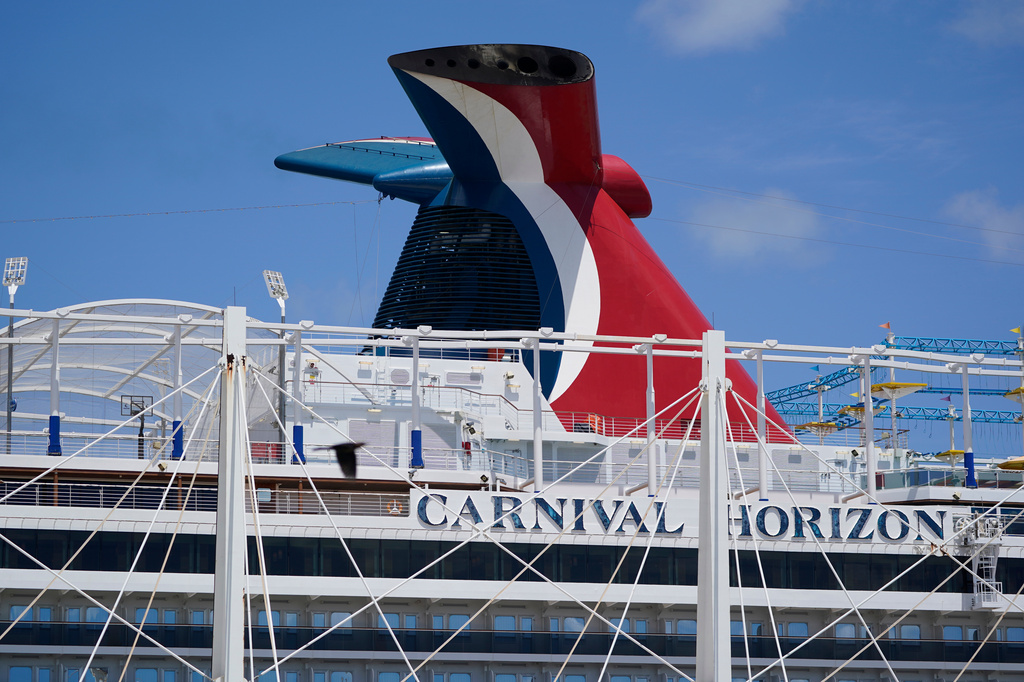 FILE - Carnival Cruise Line's Carnival Horizon cruise ship is shown docked at PortMiami, April 9, 2021, in Miami. (AP Photo/Wilfredo Lee, file)