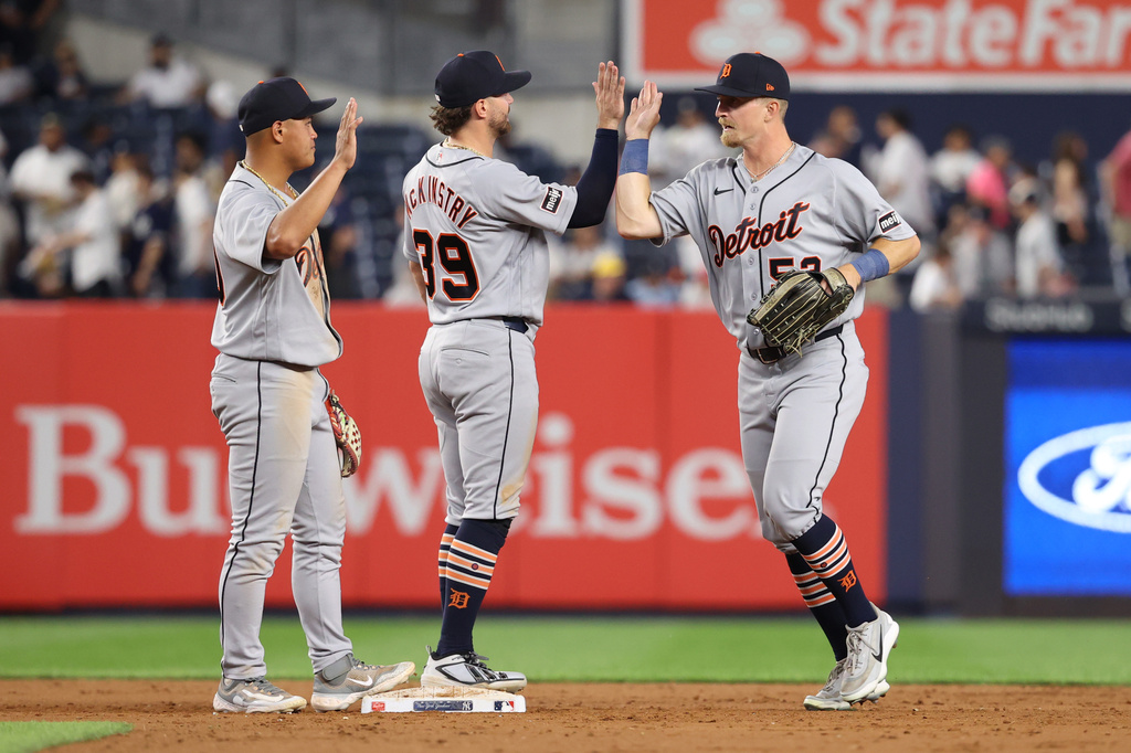 Detroit Tigers' Hao-Yu Lee, left, Zach McKinstry, center, and Ben Malgeri celebrate after defeating the New York Yankees in a baseball game Monday, June 29, 2026, in New York. (AP Photo/Pamela Smith)