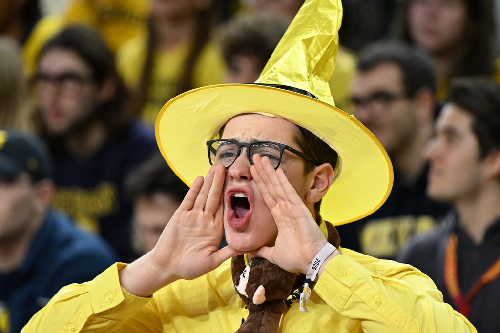 Michigan student section member, Jared Grenwald, Boca Raton, Fl, boos Indiana as they take the court before their NCAA college basketball game against the Michigan Wolverines in Ann Arbor, Mich., Tuesday, Jan. 20, 2026. (AP Photo/Lon Horwedel)