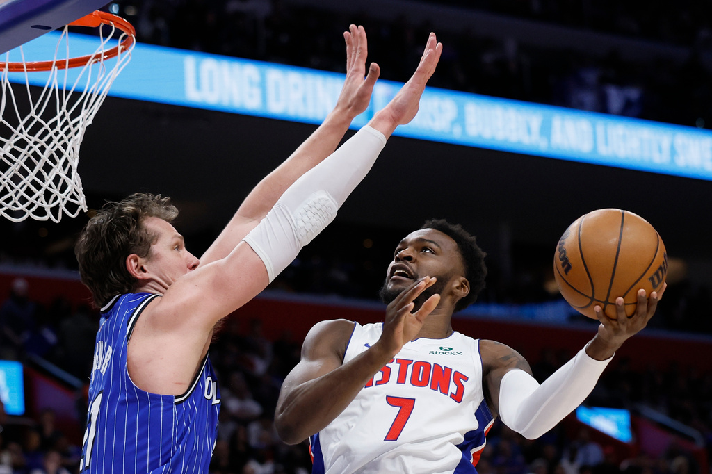 Detroit Pistons forward Paul Reed (7) goes to the basket against Orlando Magic forward Moritz Wagner, left, during the first half in Game 7 of a first-round NBA basketball playoffs series Sunday, May 3, 2026, in Detroit. (AP Photo/Duane Burleson)