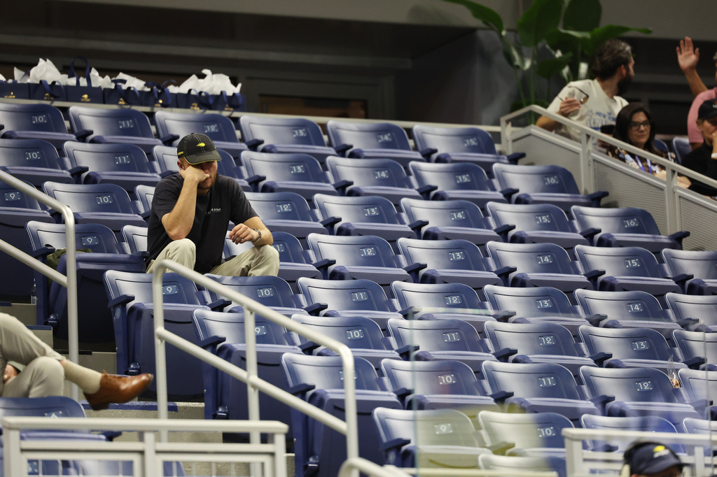 A fans watches during the fourth set of a match between Carlos Alcaraz, of Spain, and Ben Shelton, of the United States, in the quarterfinal round of the U.S. Open tennis championships, early Wednesday, Sept. 9, 2026, in New York. (AP Photo/Heather Khalifa)
