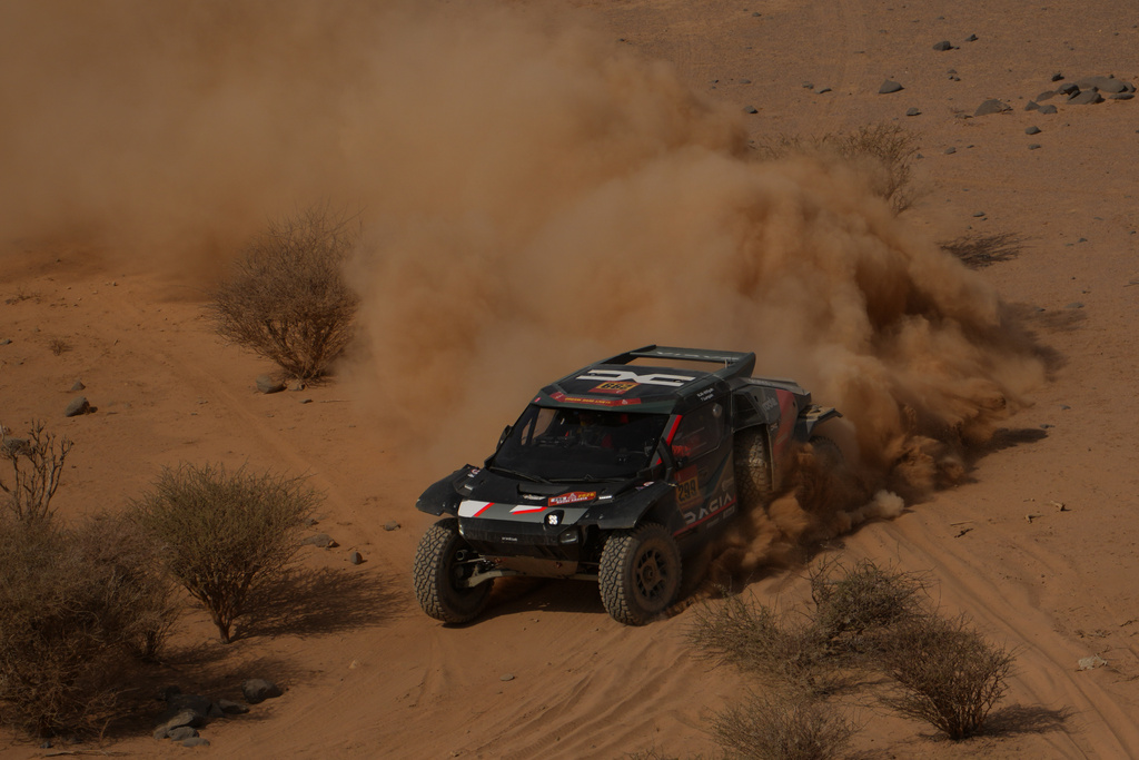 Driver Nasser Al-Attiyah and co-driver Fabian Lurquin compete during the eleventh stage of the Dakar Rally between Bisha and Al Henakiyah, Saudi Arabia, Thursday, Jan.15, 2026. (AP Photo/Thibault Camus)