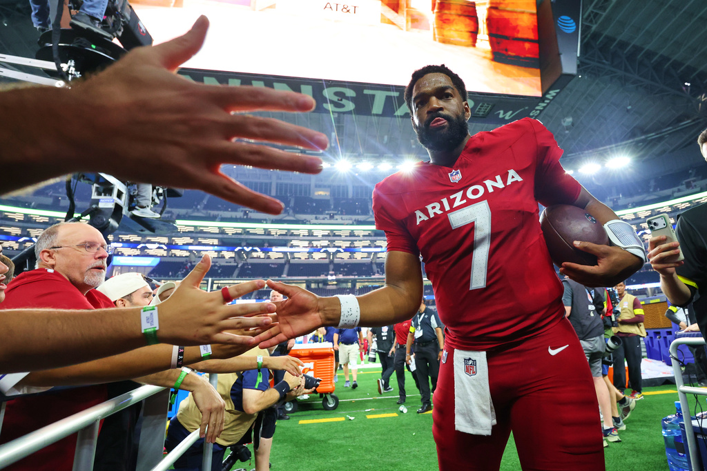 Arizona Cardinals' Jacoby Brissett (7) greets fans as he walks off the field following an NFL football game against the Dallas Cowboys Monday, Nov. 3, 2025, in Arlington, Texas. (AP Photo/Richard Rodriguez)