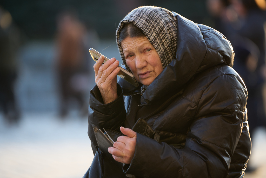 FILE - A woman speaks on her cellphone in Red Square in Moscow, on March 11, 2026. (AP Photo/Alexander Zemlianichenko, File)