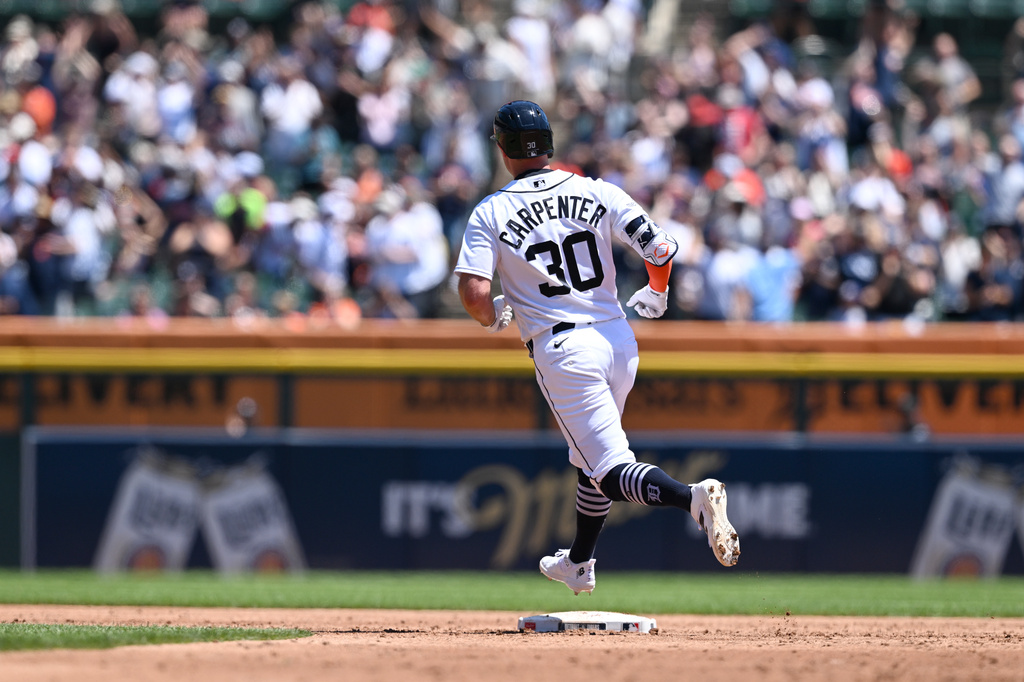 Detroit Tigers' Kerry Carpenter rounds the bases after hitting a grand slam home run against the Houston Astros in the third inning of a baseball game, Saturday, June 27, 2026, in Detroit. (AP Photo/Lon Horwedel)