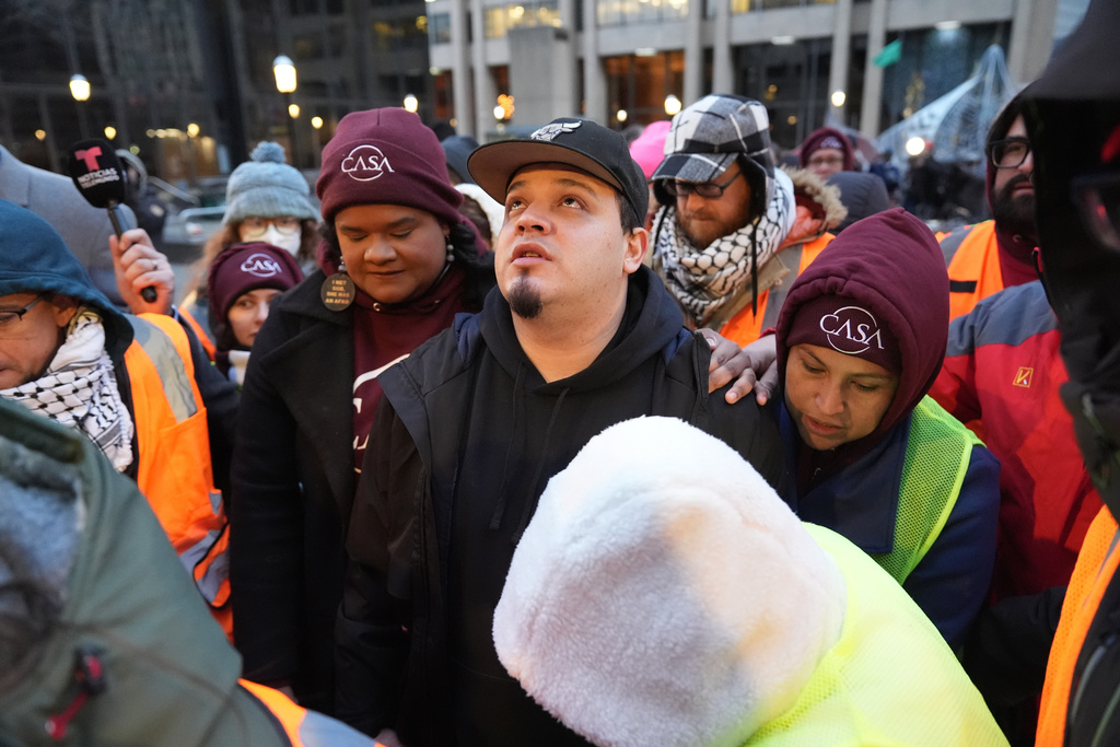 Kilmar Abrego Garcia waits to enter the building for a mandatory check at the Immigration and Customs Enforcement office in Baltimore, Friday, Dec. 12, 2025, after he was released from detention on Thursday under a judge's order. (AP Photo/Stephanie Scarbrough)