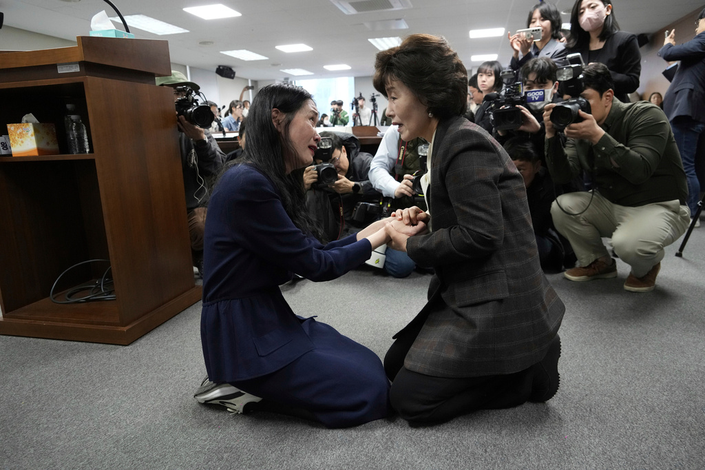 FILE - Truth and Reconciliation Commission Chairperson Park Sun Young, right, comforts adoptee Yooree Kim during a press conference in Seoul, South Korea, March 26, 2025. (AP Photo/Ahn Young-joon, File)