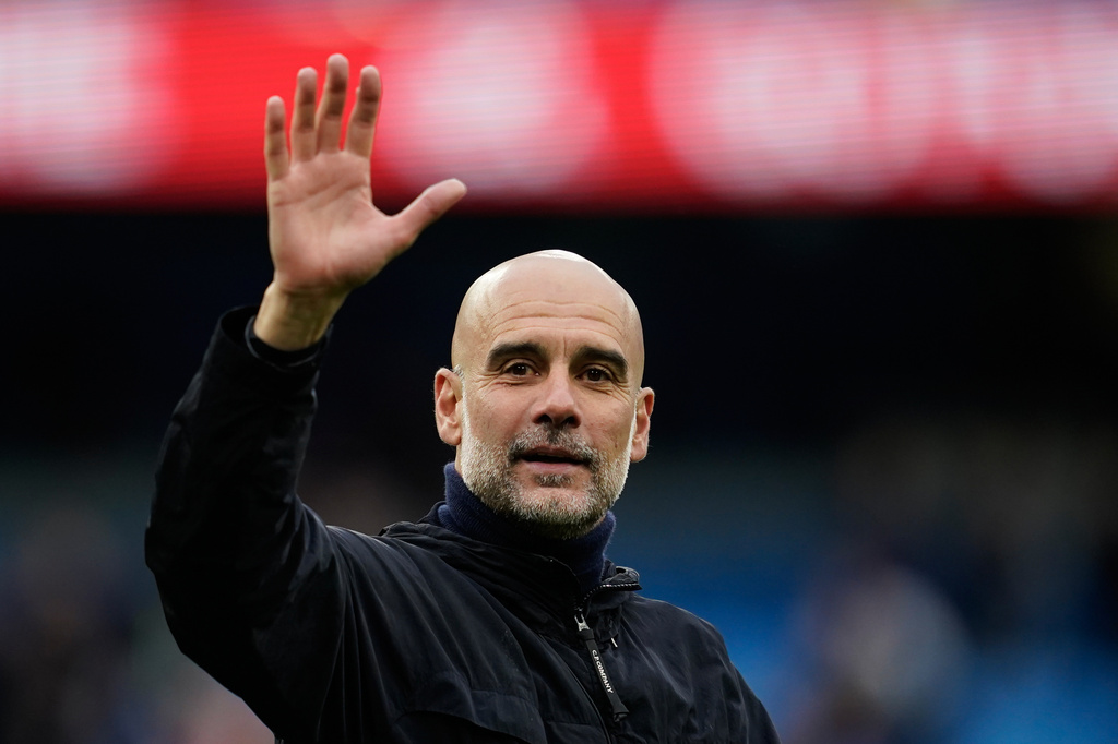 Manchester City's head coach Pep Guardiola greets fans at the end of the English Premier League soccer match between Manchester City and Brentford in Manchester, Saturday, May 9, 2026. (AP Photo/Dave Thompson)