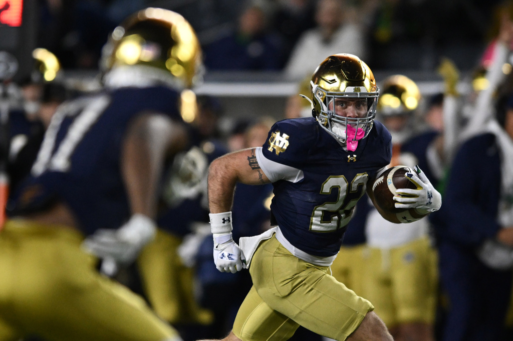 FILE - Notre Dame running back Aneyas Williams (22) rushes for a touchdown during the fourth quarter of an NCAA football game against Syracuse, Nov. 22, 2025, in South Bend, Ind. (AP Photo/Paul Beaty, File)