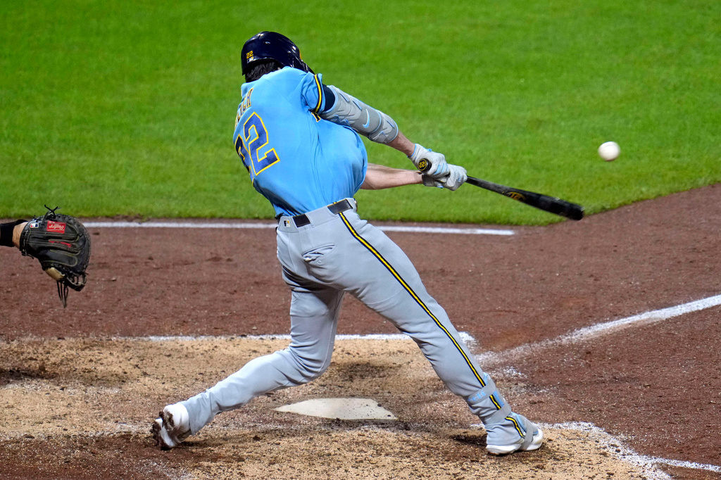Milwaukee Brewers' Christian Yelich hits a single off Pittsburgh Pirates pitcher Carmen Mlodzinski, driving in two runs, during the seventh inning of a baseball game in Pittsburgh, Wednesday, Sept. 16, 2026. (AP Photo/Gene J. Puskar)