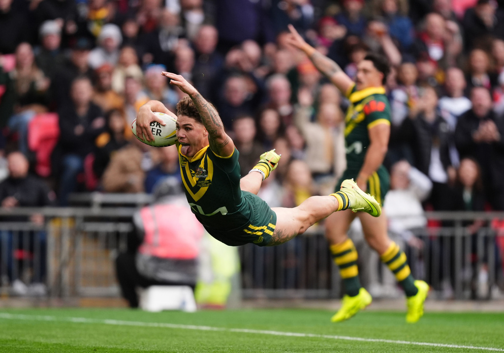 Australia's Reece Walsh scores a try, during the rugby league match between England and Australia, at Wembley Stadium, London, Saturday Oct. 25, 2025. (Mike Egerton/PA via AP)