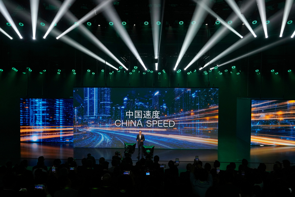 Ralf Brandstatter, Chairman and CEO of Volkswagen Group China, speaks near the slogan "China Speed" during the Volkswagen Group media night ahead of the Auto Show in Shanghai, April 22, 2025. (AP Photo/Ng Han Guan)
