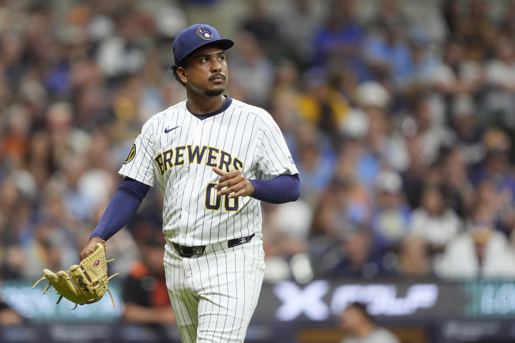 Milwaukee Brewers' Carlos Rodriguez looks on as he walks to the dugout during the seventh inning of a baseball game against the San Francisco Giants, Saturday, Aug. 23, 2025, in Milwaukee. (AP Photo/Aaron Gash)