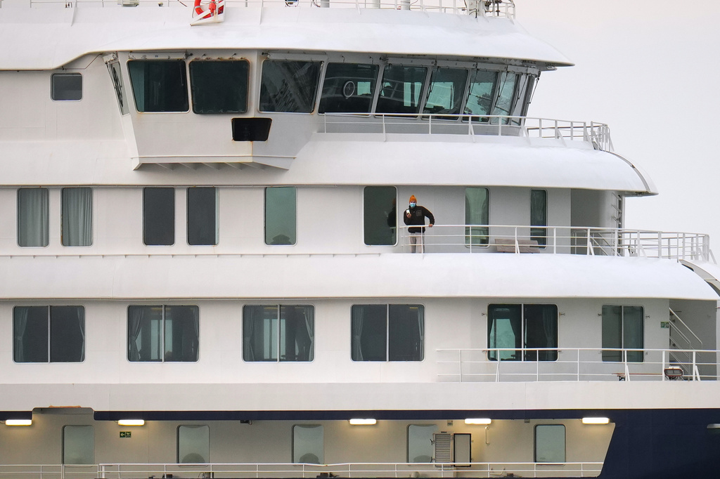 A passenger stands at the hantavirus-stricken cruise ship MV Hondius after its arrival at the port of Granadilla in Tenerife, Canary Islands, Spain, Sunday, May 10, 2026. (AP Photo/Manu Fernandez)
