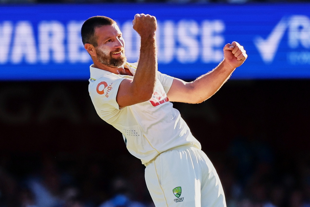 Australia's Michael Neser celebrates the wicket of England's Zak Crawley during the second Ashes cricket test match between Australia and England in Brisbane, Thursday, Dec. 4, 2025.. (AP Photo/Tertius Pickard)