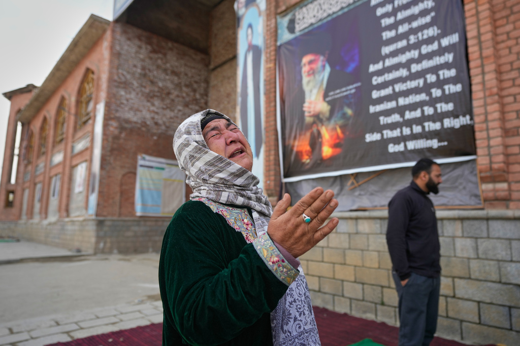 A Shiite Muslim woman is overcome with emotion as she arrives to contribute to an Iranian donation drive in Budgam, Indian-controlled Kashmir, Monday, March 23, 2026. (AP Photo/Mukhtar Khan)