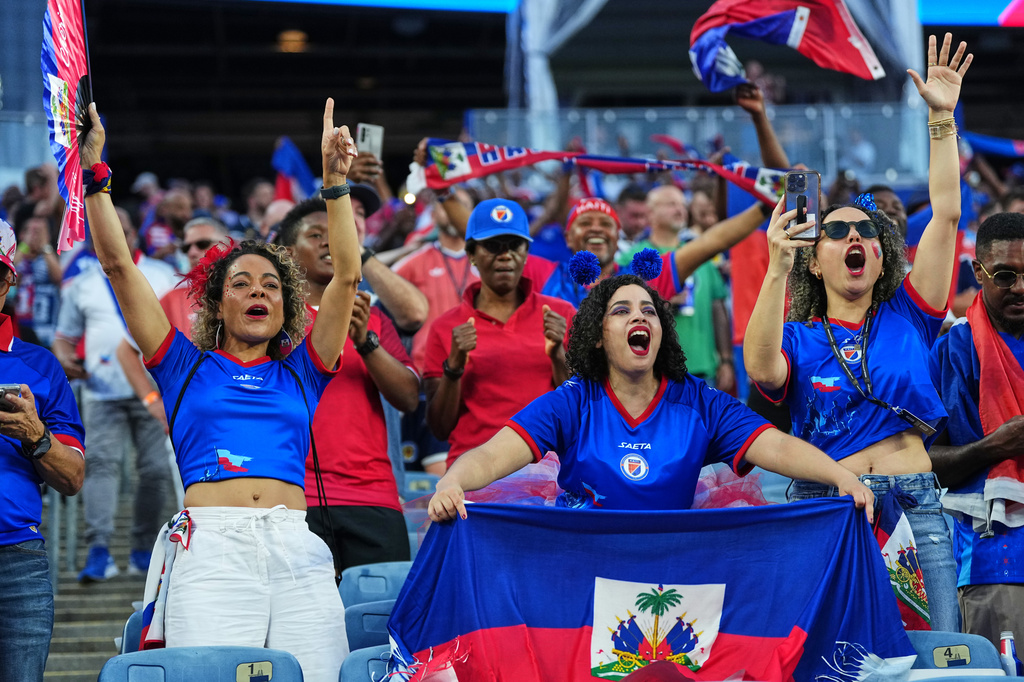 Haiti supporters react ahead of the World Cup Group C soccer match between Haiti and Scotland in Foxborough, Mass., near Boston, Saturday, June 13, 2026. (AP Photo/Martin Meissner)