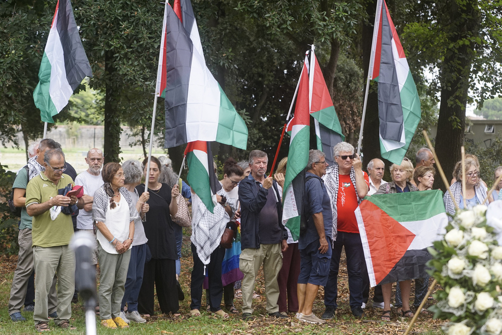 Mourners attend the funeral of 19-year-old Palestinian woman Marah Abu Zhuri in Pontesserchio, near Pisa, Italy, Wednesday Aug. 20, 2025, who died there after being evacuated from Gaza. (Alessandro La Rocca/LaPresse via AP)