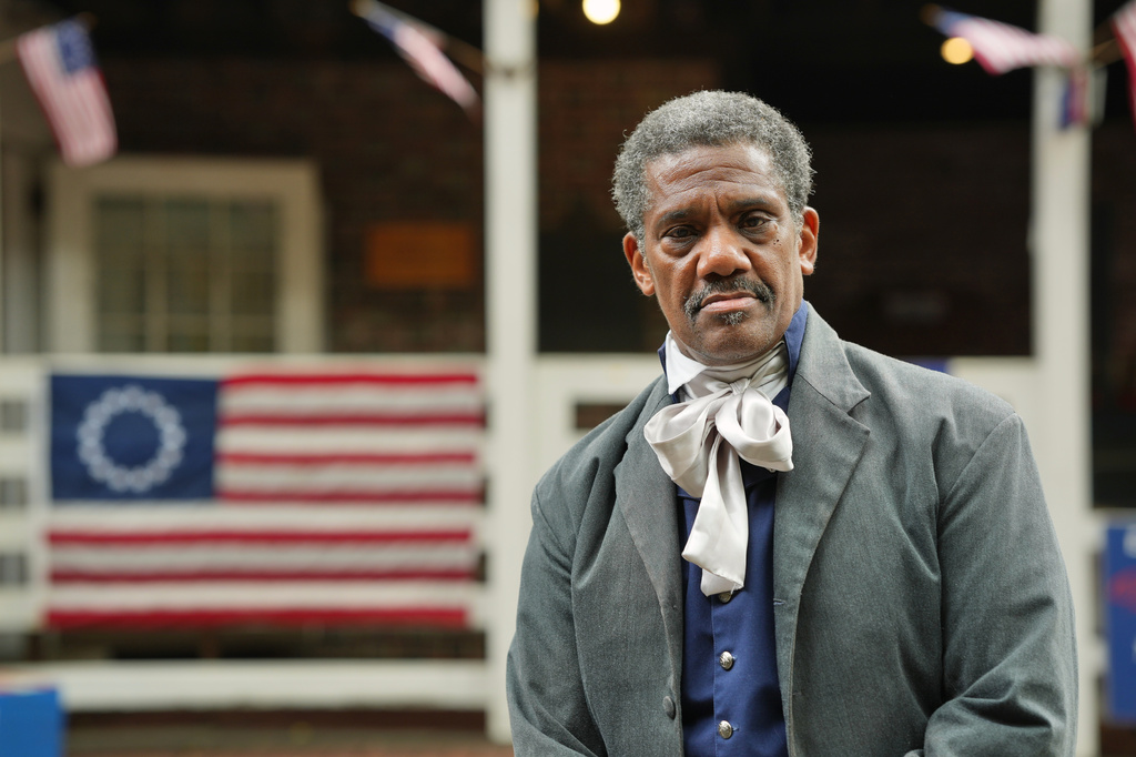 Historic reenactor Keith Henley, performing as abolitionist James Forten, poses for a photo at the Betsy Ross House in Philadelphia, July 28, 2026. (AP Photo/Mingson Lau) CORRECTION: Surname corrected to Forten instead of Fowler