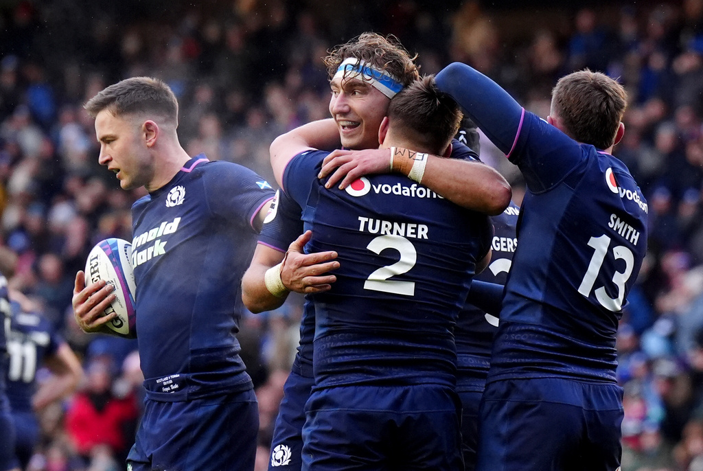 Scotland's George Turner, front center, celebrates with James Ritchie, center left, after scoring his side's second try during the Quilter Nations Series Rugby match between Scotland and Tonga in Edinburgh, Scotland, Sunday, Nov. 23, 2025. (Jane Barlow/PA via AP)