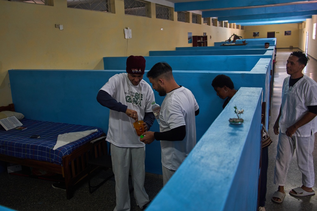 People in rehabilitation at a psychiatric hospital prepare a homemade cocoa cream candy to share in Havana, Cuba, Wednesday, Feb. 25, 2026. (AP Photo/Ramon Espinosa)