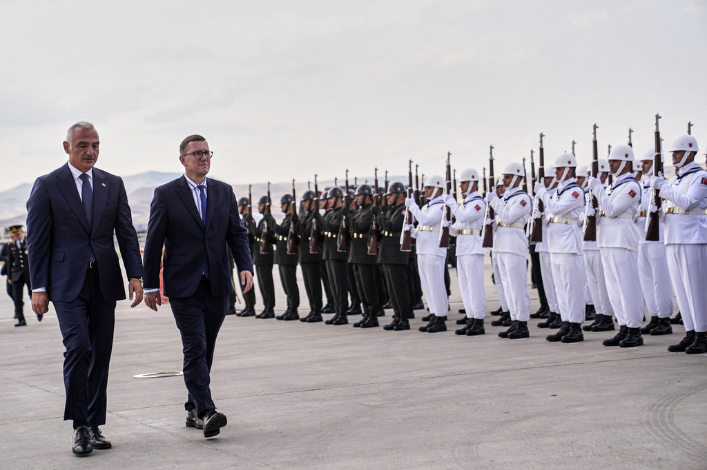 Estonia's Prime Minister Kristen Michal, center left, walks with Turkish Culture and Tourism Minister Mehmet Nuri Ersoy, left, during airport arrivals ahead of the NATO Summit in Ankara, Turkey, Monday, July 6, 2026. (Metin Aktas, Pool Photo via AP)
