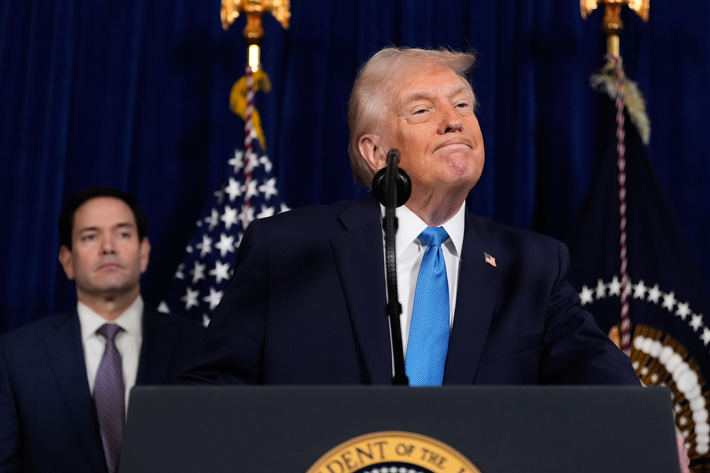 President Donald Trump listens to a question during a news conference at Mar-a-Lago, Saturday, Jan. 3, 2026, in Palm Beach, Fla., as Secretary of State Marco Rubio watches. (AP Photo/Alex Brandon)