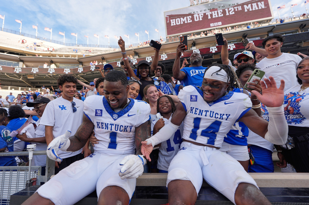 Kentucky's CJ Baxter Jr. (1) and Ty Bryant (14) celebrate after an NCAA college football game against Texas A&M Saturday, Sept. 19, 2026, in College Station, Texas. (AP Photo/David J. Phillip)
