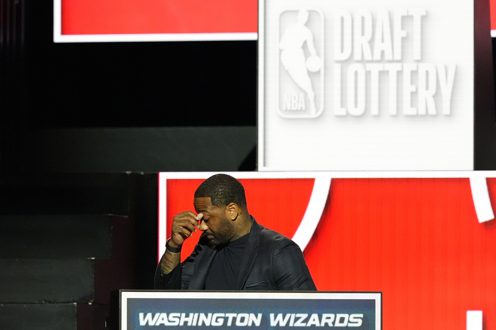 Washington Wizards' John Wall reacts after NBA Deputy Commissioner Mark Tatum announced that the Washington Wizards won the first pick in the NBA basketball draft lottery in Chicago, Sunday, May 10, 2026. (AP Photo/Nam Y. Huh)