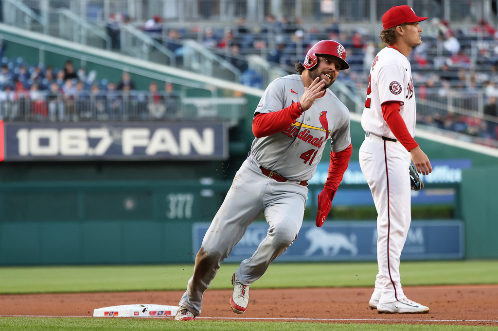St. Louis Cardinals' Alec Burleson rounds third base and scores during the first inning of a baseball game against the Washington Nationals, Tuesday, April 7, 2026, in Washington. (AP Photo/Daniel Kucin Jr.)