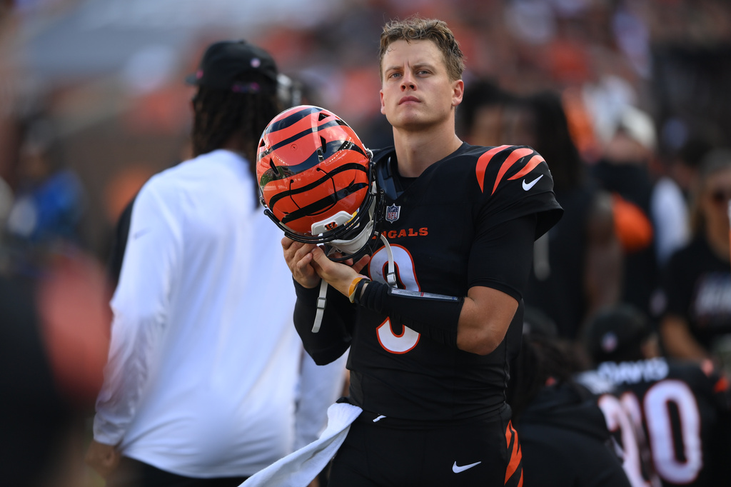 Cincinnati Bengals quarterback Joe Burrow (9) looks on from the bench during an NFL football game against the Jacksonville Jaguars in Cincinnati, Sunday, Oct. 4, 2026. (AP Photo/Tanner Pearson)