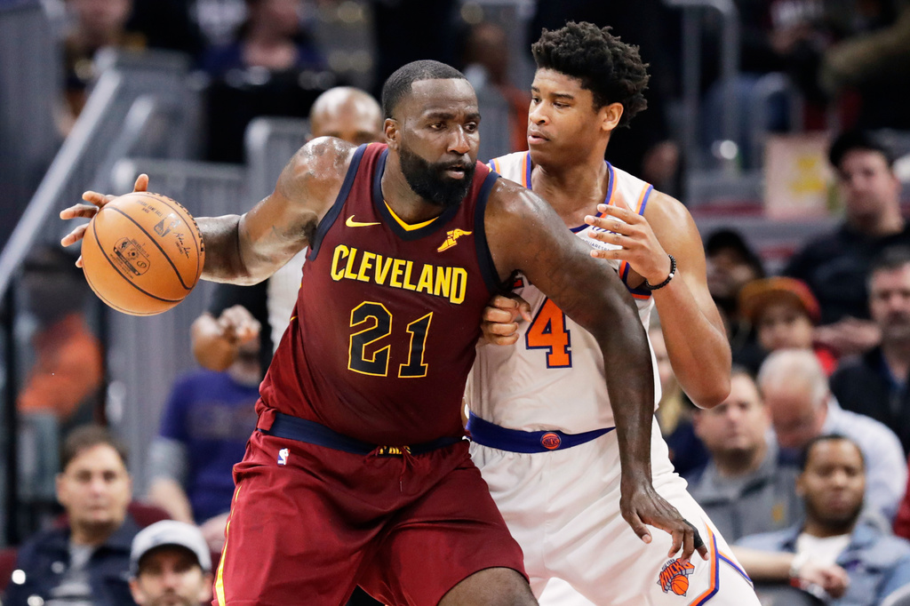 FILE - Cleveland Cavaliers' Kendrick Perkins (21) drives past New York Knicks' Isaiah Hicks (4) in the second half of an NBA basketball game, April 11, 2018, in Cleveland. (AP Photo/Tony Dejak, File)