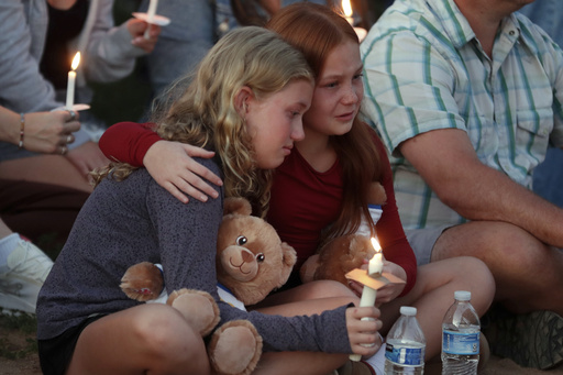 People gather at a vigil at Lynnhurst Park after a shooting at the Annunciation Catholic School, Wednesday, Aug. 27, 2025, in Minneapolis. (AP Photo/Bruce Kluckhohn) People gather at a vigil at Lynnhurst Park after a shooting at the Annunciation Catholic School, Wednesday, Aug. 27, 2025, in Minneapolis. (AP Photo/Bruce Kluckhohn)