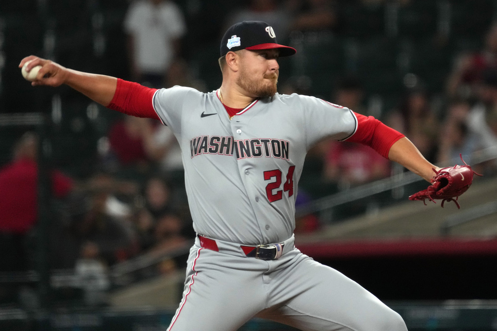 Washington Nationals pitcher Cade Cavalli throws against the Arizona Diamondbacks in the first inning of a baseball game, Sunday, June 7, 2026, in Phoenix. (AP Photo/Rick Scuteri)