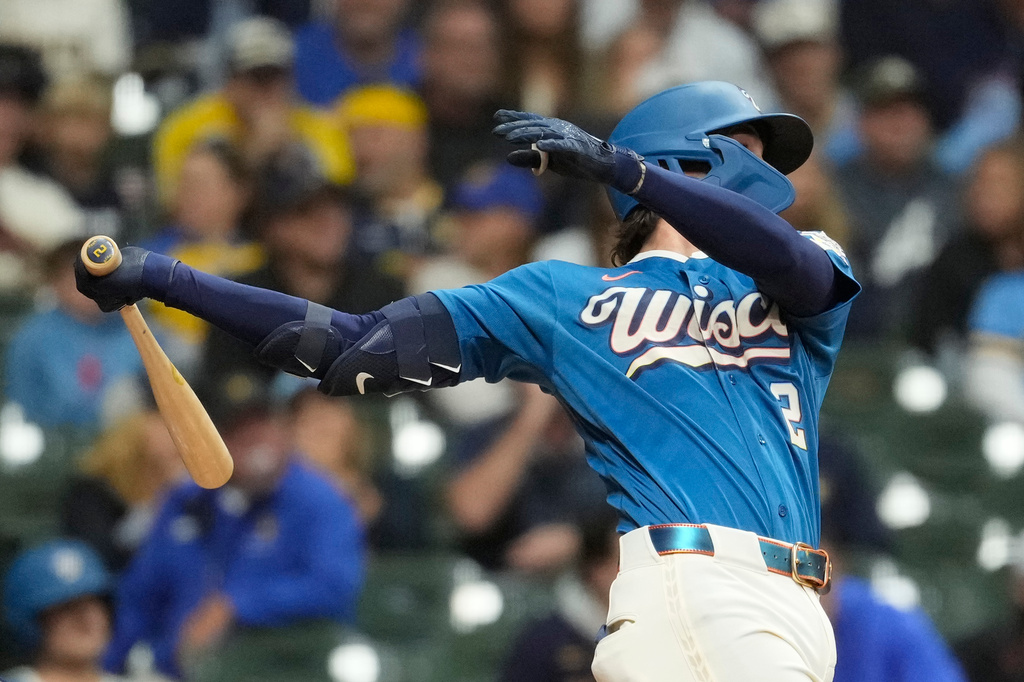 Milwaukee Brewers' Brice Turang hits an RBI double during the first inning of a baseball game against the St. Louis Cardinals, Friday, Sept. 25, 2026, in Milwaukee. (AP Photo/Aaron Gash)