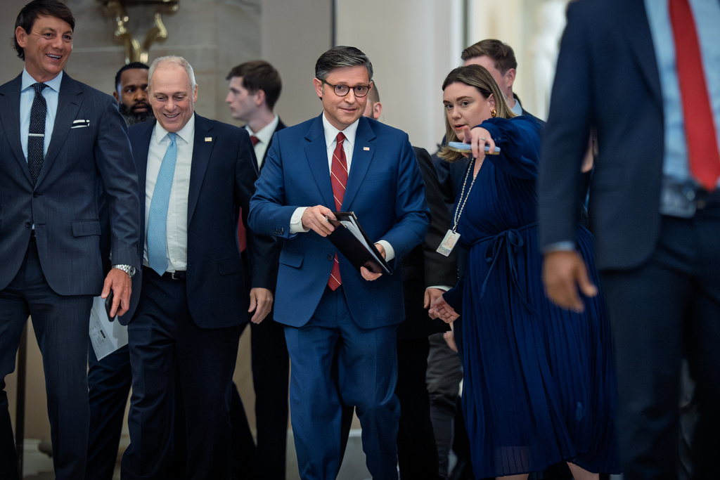 Speaker of the House Mike Johnson, R-La., joined at left by Majority Leader Steve Scalise, R-La., arrives to speak with reporters after the final vote to bring the longest government shutdown in history to an end, at the Capitol in Washington, Wednesday, Nov. 12, 2025. (AP Photo/J. Scott Applewhite)