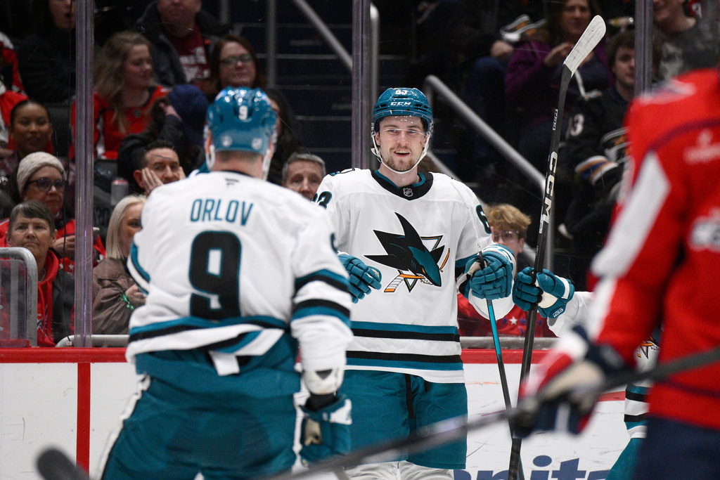 San Jose Sharks center Zack Ostapchuk, right, celebrates his goal with San Jose Sharks defenseman Dmitry Orlov (9) during the second period of an NHL hockey game against the Washington Capitals, Thursday, Jan. 15, 2026, in Washington. (AP Photo/Nick Wass)