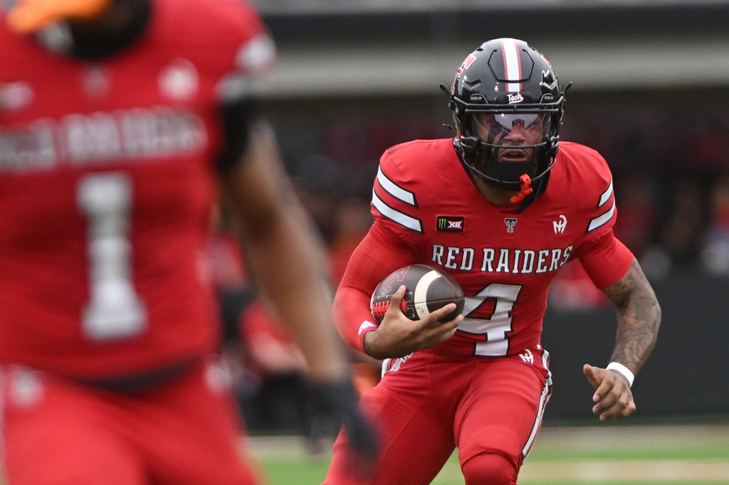 Texas Tech quarterback Tommy Castellanos (4) runs with the ball during the first half of an NCAA college football game against Arizona, Saturday, Oct. 31, 2026, in Lubbock, Texas. (AP Photo/Annie Rice)