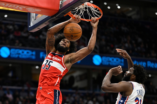 Washington Wizards forward Marvin Bagley III (35) dunks against Philadelphia 76ers center Joel Embiid during the first half of an NBA basketball game Tuesday, Oct. 28, 2025, in Washington. (AP Photo/John McDonnell) Washington Wizards forward Marvin Bagley III (35) dunks against Philadelphia 76ers center Joel Embiid during the first half of an NBA basketball game Tuesday, Oct. 28, 2025, in Washington. (AP Photo/John McDonnell)