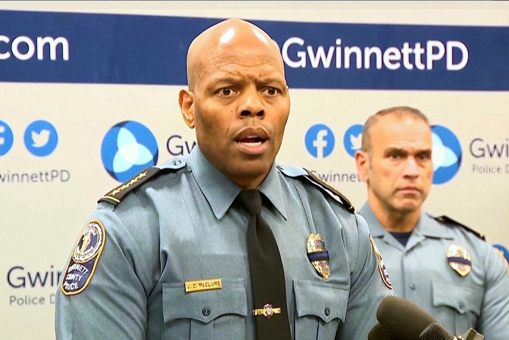 An image taken from WSB video shows Gwinnett County Police Chief J.D. McClure speaks at a news conference Sunday, Feb. 1, 2026, in Gwinnett County, Ga., following the shootings of two officers at a hotel. (WSB via AP)