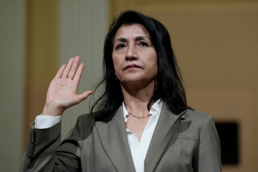 FILE - Gulbahar Haitiwaji, an ethnic Uyghur who wrote a book about the experience of being held in two "re-education" camps and police stations in China for more than two years, is sworn in to testify during a special House committee hearing dedicated to countering China, Thursday, March 23, 2023, on Capitol Hill in Washington. (AP Photo/Carolyn Kaster, File) FILE - Gulbahar Haitiwaji, an ethnic Uyghur who wrote a book about the experience of being held in two "re-education" camps and police stations in China for more than two years, is sworn in to testify during a special House committee hearing dedicated to countering China, Thursday, March 23, 2023, on Capitol Hill in Washington. (AP Photo/Carolyn Kaster, File)