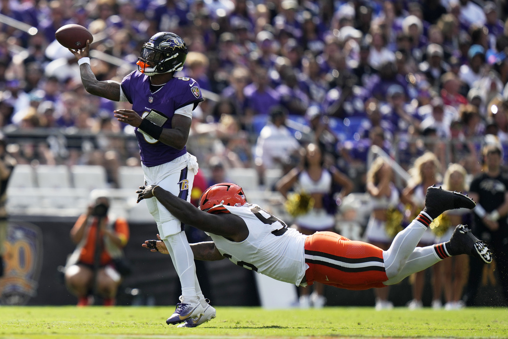 Baltimore Ravens quarterback Lamar Jackson throws under pressure from Cleveland Browns defensive tackle Maliek Collins during the second half of an NFL football game, Sunday, Sept. 14, 2025, in Baltimore. (AP Photo/Stephanie Scarbrough)