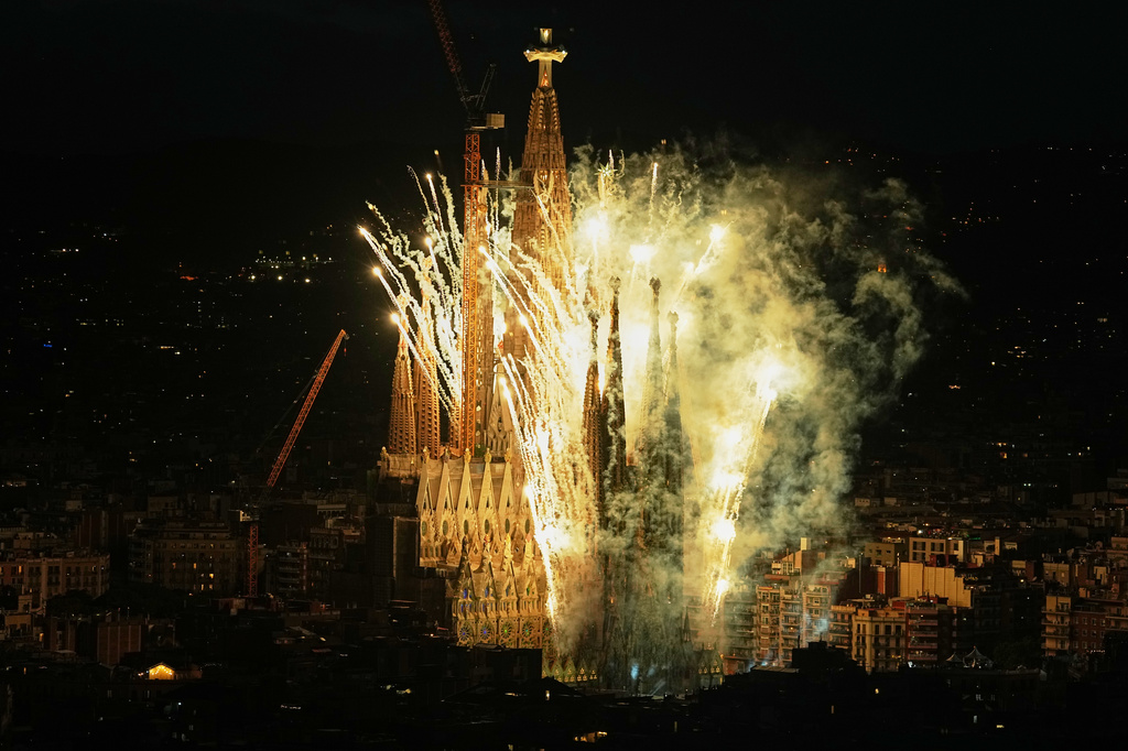 Fireworks engulf Antoni Gaudí's Basilica of the Sagrada Família, seen from Torre Glòries, after Pope Leo XIV blessed the newly completed central Tower of Jesus Christ in Barcelona, Spain, Wednesday, June 10, 2026. The tower's completion made the Sagrada Família, at 172.5 meters (566 feet), the tallest church in the world. (AP Photo/Fatima Shbair)