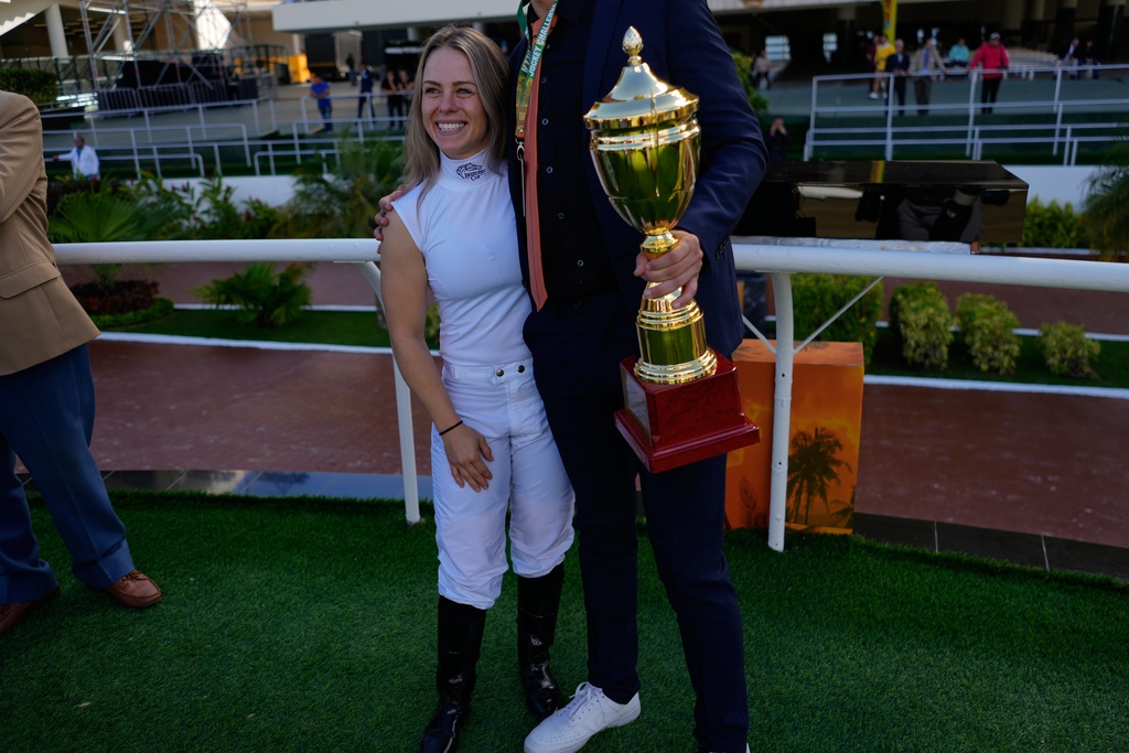 Jockey Katie Davis, of the United States, celebrates after winning a race during the 56th Jockey Challenge 56 at Rinconada racetrack in Caracas, Venezuela, Sunday, Dec 14, 2025. (AP Photo/Ariana Cubillos)