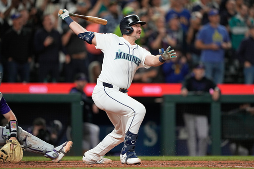 Seattle Mariners' Cal Raleigh watches his 60th home run during the eighth inning of a baseball game against the Colorado Rockies, Wednesday, Sept. 24, 2025, in Seattle. (AP Photo/Ryan Sun) Seattle Mariners' Cal Raleigh watches his 60th home run during the eighth inning of a baseball game against the Colorado Rockies, Wednesday, Sept. 24, 2025, in Seattle. (AP Photo/Ryan Sun)