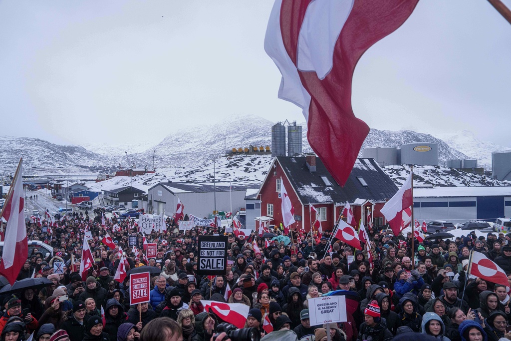 People protest against Trump's policy towards Greenland in front of the US consulate in Nuuk, Greenland, Saturday, Jan. 17, 2026. (AP Photo/Evgeniy Maloletka)