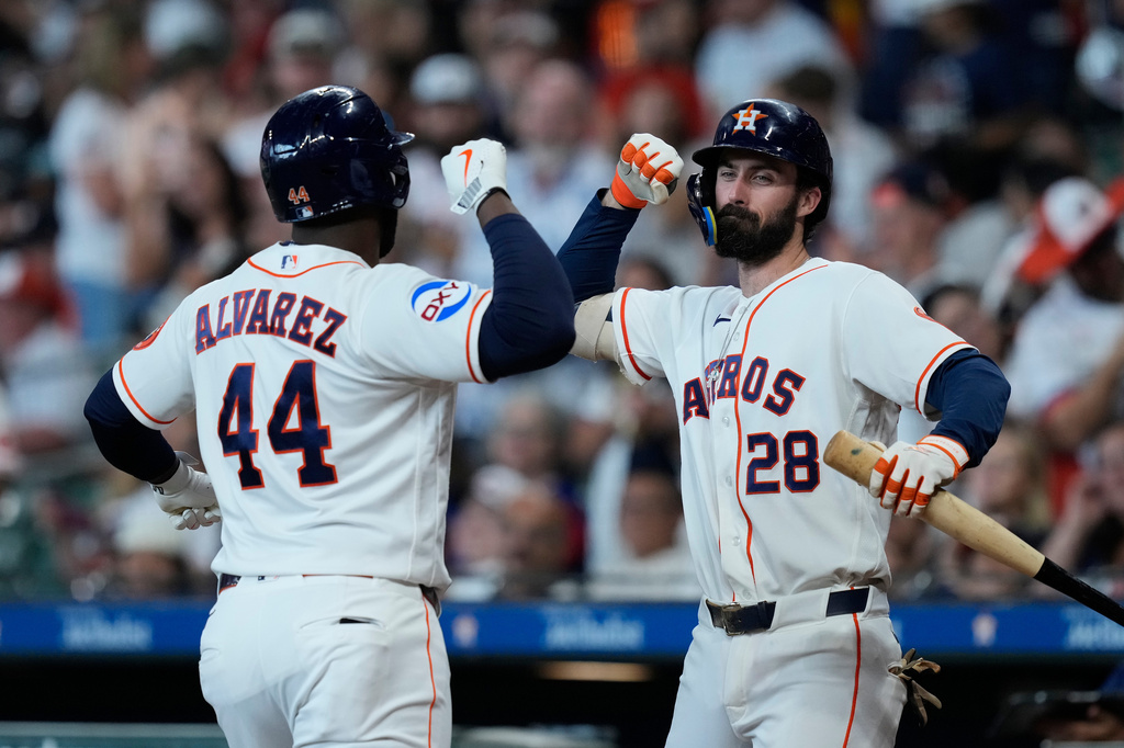 Houston Astros designated hitter Yordan Alvarez (44) celebrates with Braden Shewmake (28) after hitting a solo home run during the first inning of a baseball game against the Texas Rangers, Saturday, May 16, 2026, in Houston. (AP Photo/Kevin M. Cox)