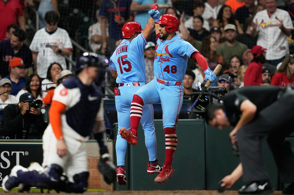 St. Louis Cardinals' José Fermín (15) celebrates with Iván Herrera after hitting a home run during the sixth inning of a baseball game Houston Astros in Houston, Saturday, April 18, 2026. (AP Photo/Ashley Landis)