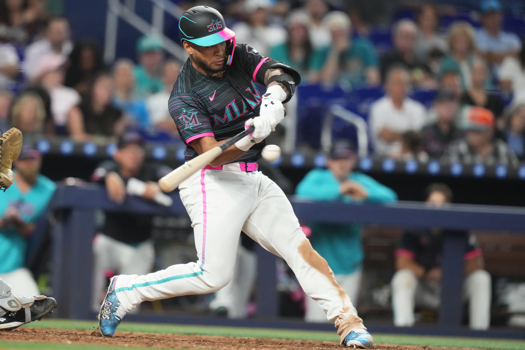 Miami Marlins' Agustín Ramírez hits. Single during the fifth inning of a baseball game against the Colorado Rockies, Saturday, March 28, 2026, in Miami. (AP Photo/Lynne Sladky)